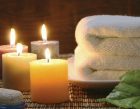 Towel, aromatic candles and other spa objects to make mood relaxing