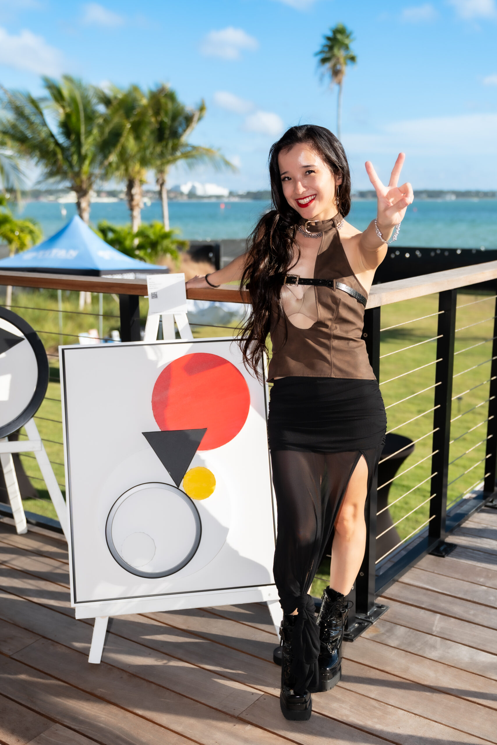 An enthusiastic Wai Ching Shcroeder poses with her work.